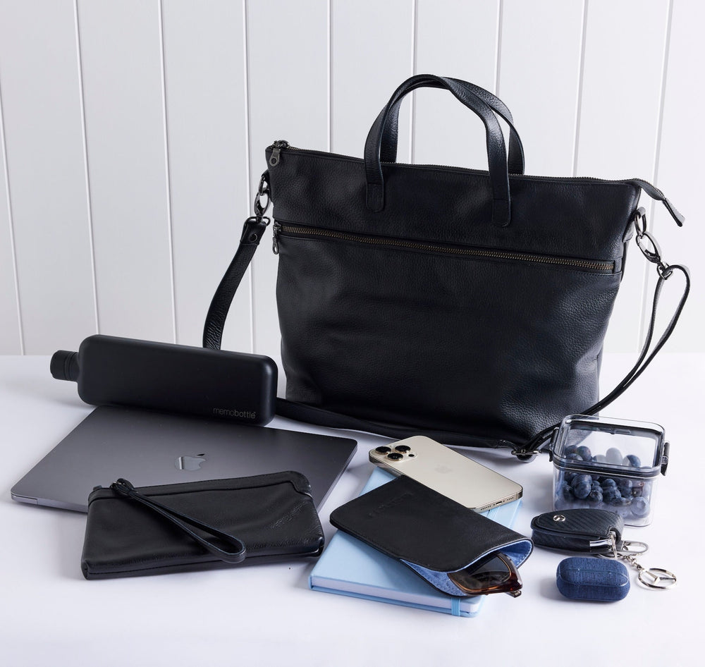 Rome leather tote with items in front to show what fits inside.