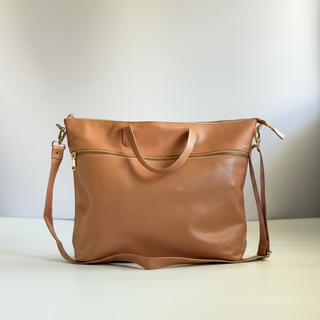 Blush leather handbag on a light background